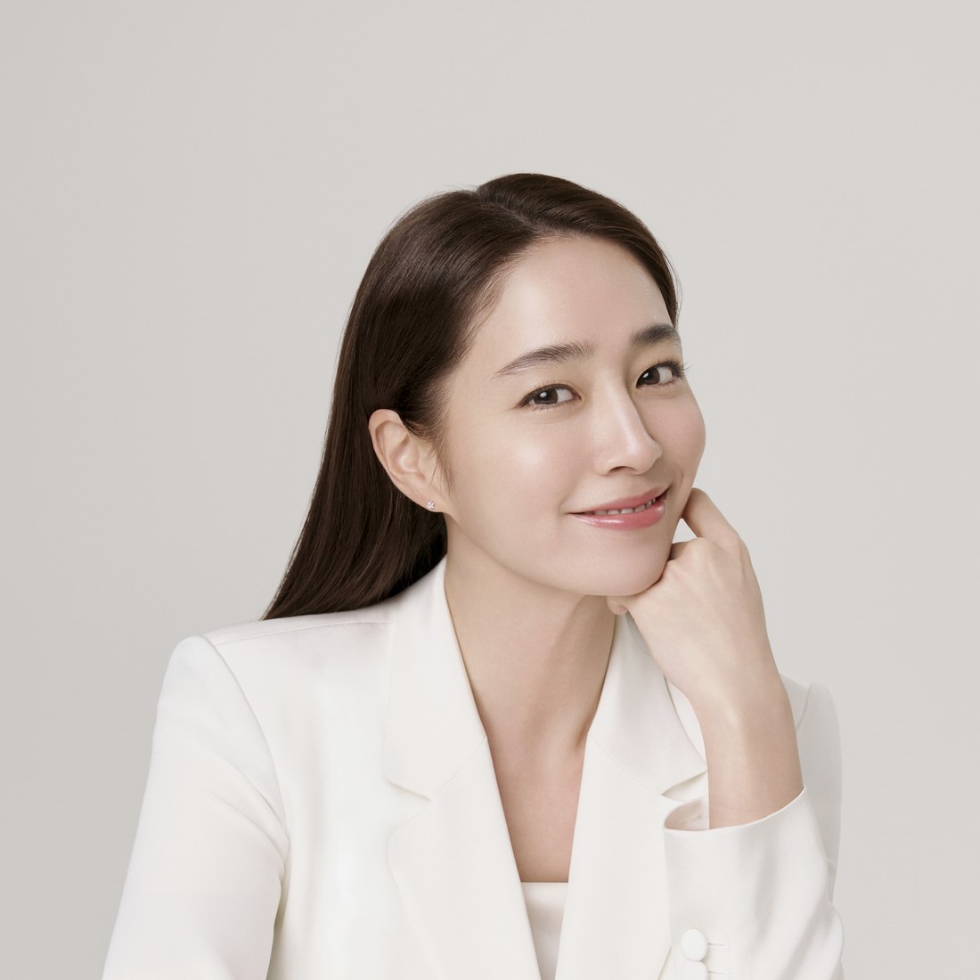 A woman enjoying a calming Korean skincare routine
